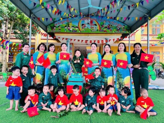 may dong phuc giao vien mam non